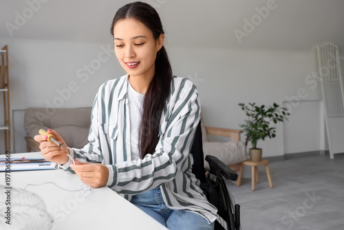 Young Asian woman in wheelc...