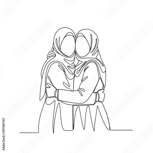 Two women in headscarves hugging each other.