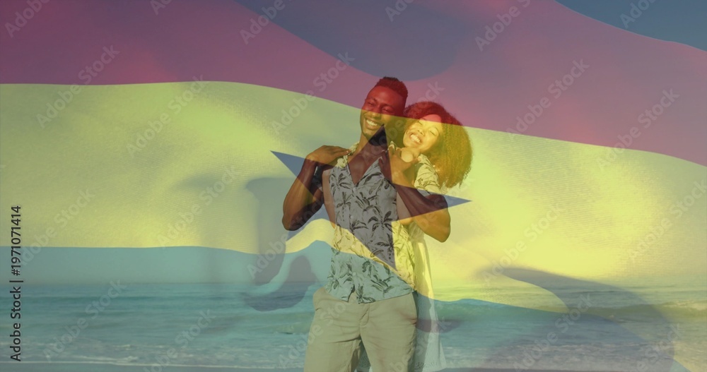 Obraz premium Standing couple embracing on beach at sunset, wearing shirt and sundress, Ghana flag overlay
