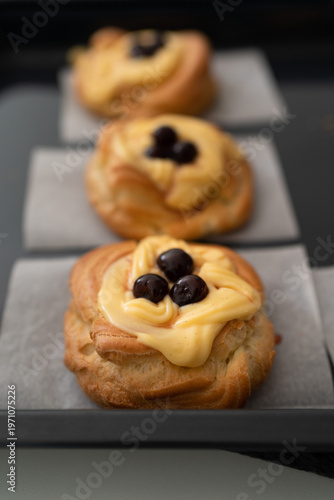 Zeppole di San Giuseppe: a traditional Italian dessert dedicated to Father's Day. They can be either fried or baked, then filled with lemon-scented pastry cream and topped with amarena cherries.