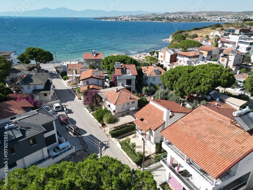 Fotografía Aerial establishing shot of a Mediterranean coastal neighborhood with terracotta