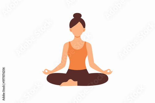 Young female practicing yoga at home in casual attire with natural hair bun