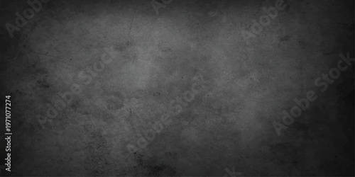 A dark grunge wall texture with a rough vintage concrete surface and old grey paint creates a blank dirty stone backdrop for a textured canvas pattern background