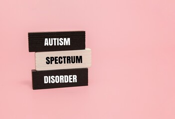 Colorful blocks with text AUTISM SPECTRUM DISORDER. Healthcare, education or mental health awareness concepts