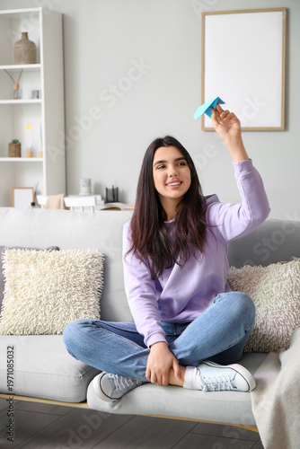 Young woman with paper plan...