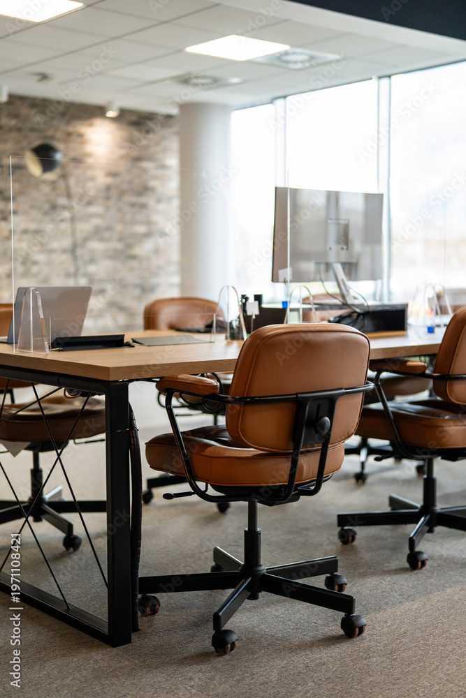 Fototapeta premium Modern open plan office space with unoccupied desks