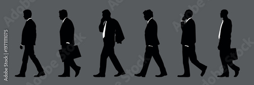 Silhouettes of business professionals walking vector set
