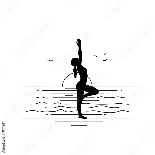 Woman in yoga tree pose outdoors.