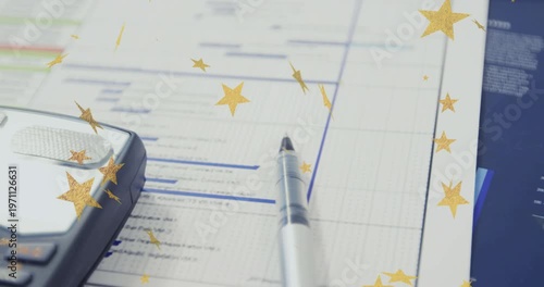 Star overlay appearing, camera panning left showing calculator and pen on finance chart celebrating