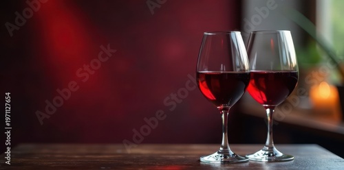 Two wine glasses filled with red wine, clinking , affection, cheers