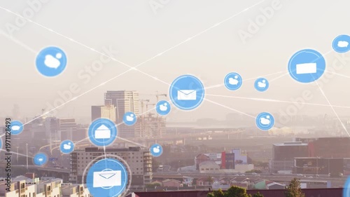 Large blue envelope appearing over skyline, icons multiplying and forming tech data network overlay