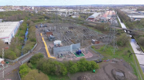An aerial pullback movement of a high voltage electricity substation in the Midlands, UK