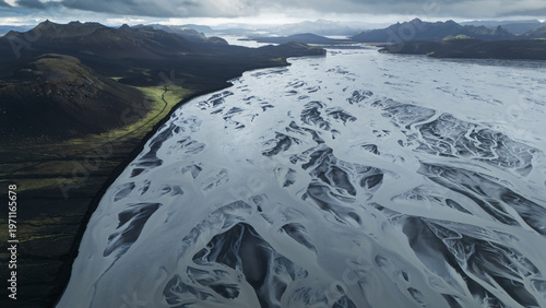 Aerial view of beautiful mountainous volcanic landscape with huge glacial rivers streaming, Iceland