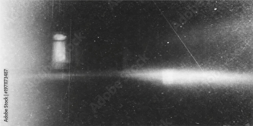 An ethereal, long-exposure photograph captures the stark contrast between light and shadow. The streaks of light create a dynamic and dramatic effect, evoking a sense of speed and movement.