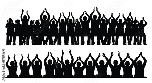 A group of people standing in two rows with raised hands in celebration.