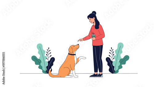 Young woman holding a cup of coffee interacts with her brown and white dog while it performs a trick by raising its paw in a garden.