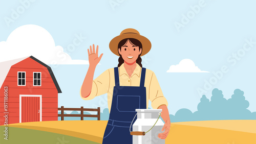 Smiling female dairy farmer in overalls and a hat waves while holding a large metal milk can on a rural farm with a classic red barn.