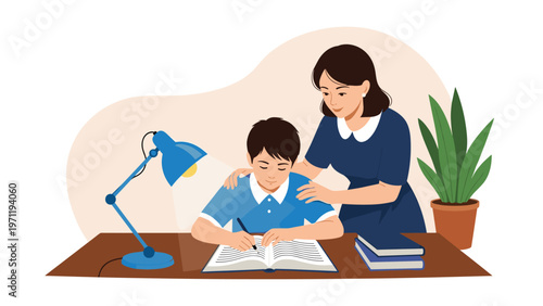 Caring mother leaning over her young son to help him with his school assignments at a desk with a lamp and books in a warm atmosphere.
