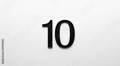Minimalist Black and White Composition Depicting the Number Ten on a Plain White Backdrop