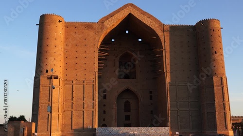 Scenic early morning sunrise view of the main facade of the historical Mausoleum of Khoja Ahmed Yasawi (Қожа Ахмет Ясауи) (from bottom the top), Turkestan, Kazakhstan