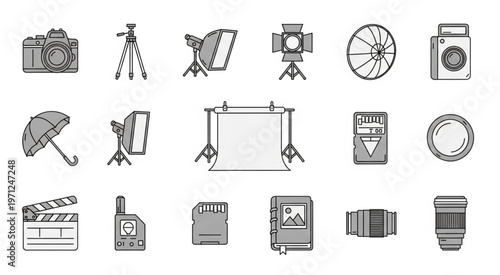 Photography equipment collection - camera, tripod, softbox, flash, umbrella, and more.