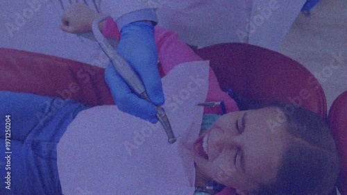 A young patient is scared during a dental check-up at a clinic