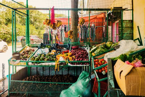 Vibrant Fresh Produce vendor Stall at a roadside with avocados, bananas, potatoes and other produce in Nairobi, Kenya