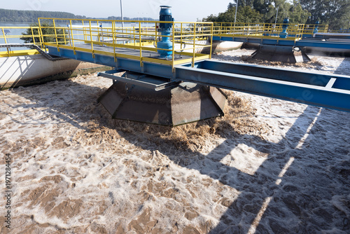 Slika na platnu Wastewater treatment plant aeration basin with rotating clarifier and industrial