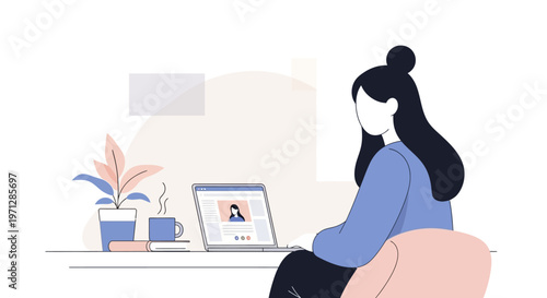 Calm young woman typing on a laptop and engaged in a video call at her modern desk in a bright home office setting.