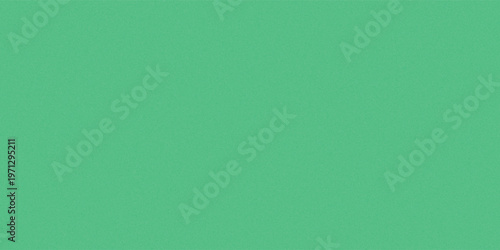 A close-up view of a textured green surface, resembling blades of grass. The color is a vibrant, consistent green with a subtle, granular pattern throughout.