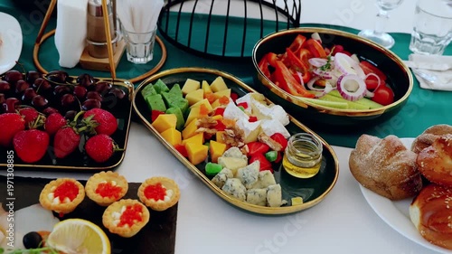 Artisanal cheese selection displaying colorful fruits, vegetables, pastries, highlighting gourmet craftsmanship and elegant dining experience