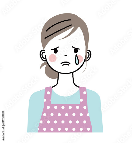 エプロンをした女性　悲しそうに涙を流して泣いている女性