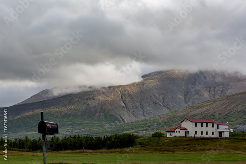 VILLAGE, EASTERN ICELAND, Mountains in the distance with a mailbox in the foreground