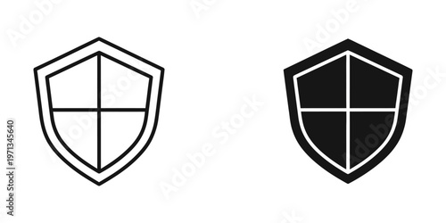 Contrast between a plain and filled shield emblem with a central cross design