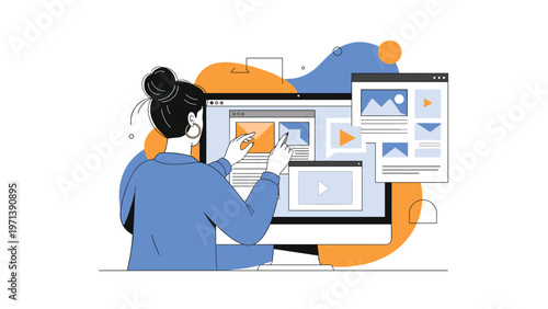 Woman from behind working on a large computer screen managing multiple windows with video and image content for digital design.