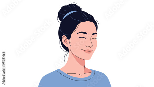 Beautiful young woman with a hair bun smiles peacefully with her eyes closed in a moment of relaxation and joy.
