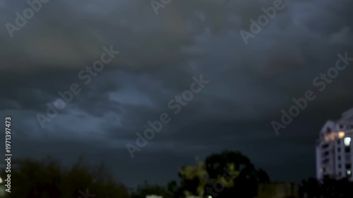 storm clouds over the city with lightnings, stormy day weather, dark clouds with lightnings, storm background