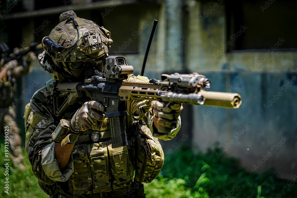 Fototapeta premium Soldier in camouflage gear aims tactical rifle with advanced optics and suppressor