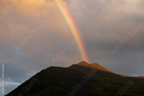 Rainbow on top of an Icelandic mountain peak