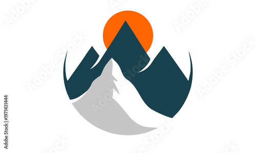 Mountains rise sharply against vibrant orange sunset sky