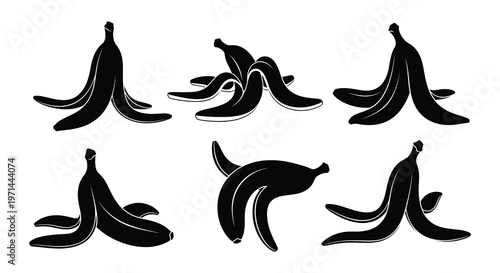 Collection of black silhouette banana peels arranged in various positions
