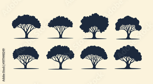 Eight dark blue tree silhouettes with branching trunks on a light cream background