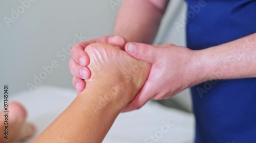 A woman enjoys a relaxing foot and leg massage at a spa, receiving professional care for wellness and relaxation.