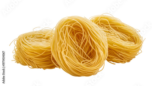 Bild auf Leinwand Three nests of uncooked golden angel hair pasta, isolated on transparent backgro