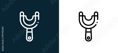 Two-color slingshot outline icon pair in black and white, editable stroke vector illustration for web, mobile apps, UI design, branding, and print from children toys
