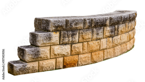 Konstfotografi Curved retaining wall made of stacked rough textured stone blocks, isolated on t