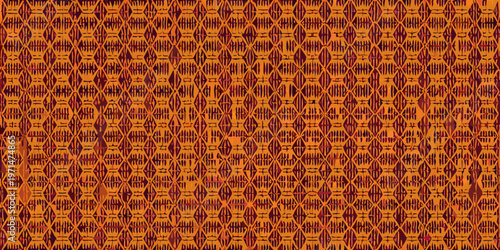 Intricate orange and brown woven textile with repeating diamond patterns