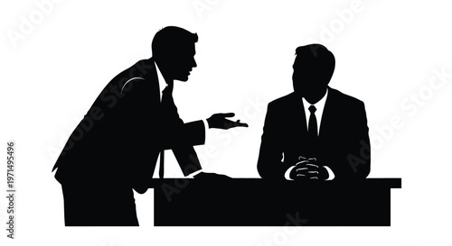 Two businessmen in suits engaged in conversation across a desk silhouette