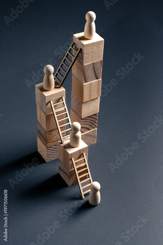 фотографія Career Progression and Leadership Hierarchy Concept with Wooden Figures and Bloc