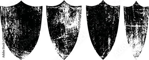 set of four vintage medieval shields with distressed and worn textures